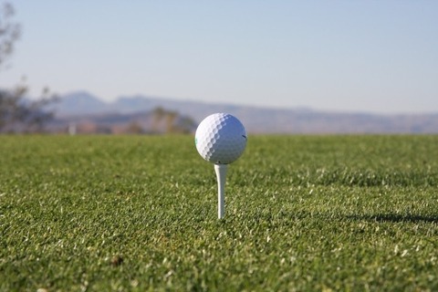 golf-ball-on-tee-in-grass