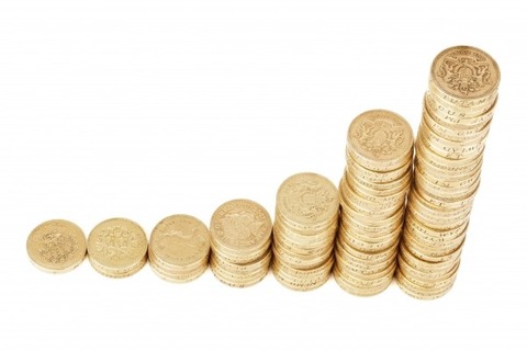 piles-of-coins-on-white-background-1